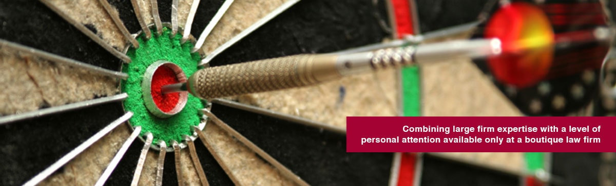 Dart arrow hitting in the target center of dartboard